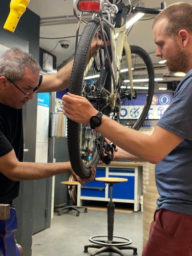 a man fixing a bicycle